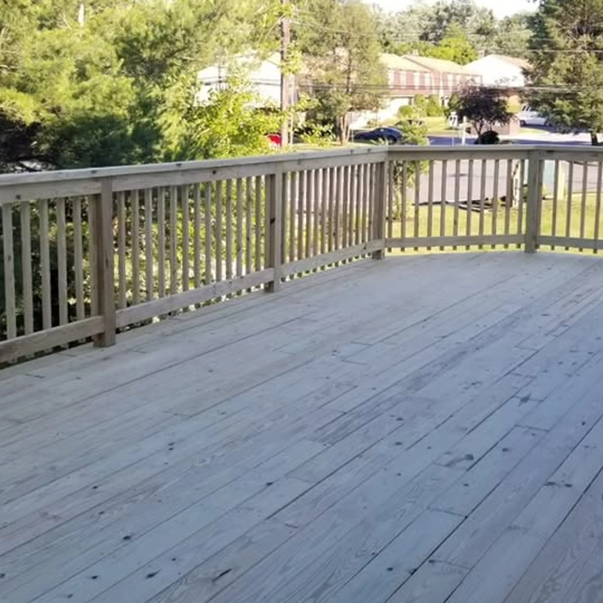 well-lit backyard deck needing maintenance
